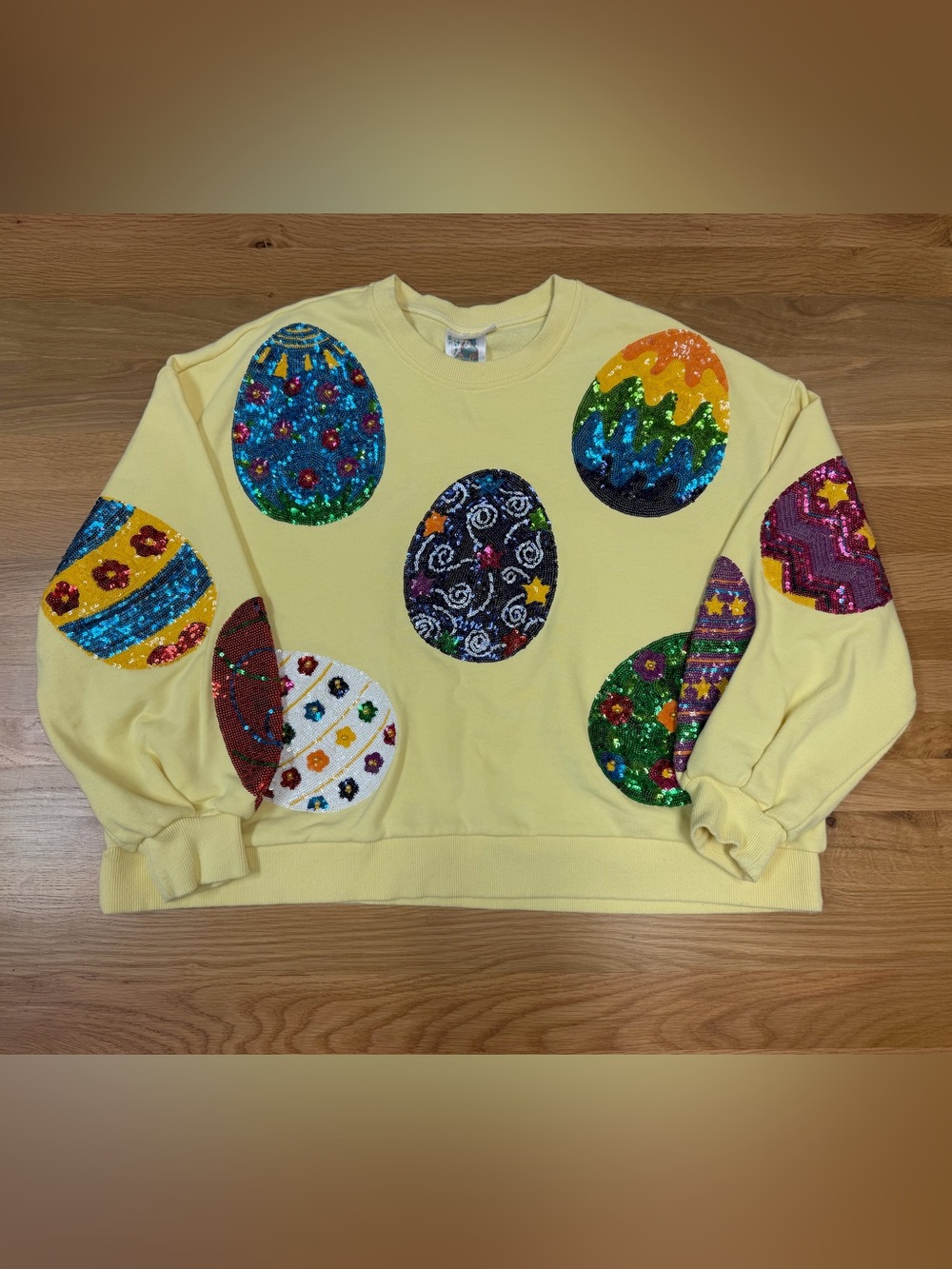 QUEEN OF SPARKLES Yellow Sweatshirt with Multicolor Sequin Egg Appliqués